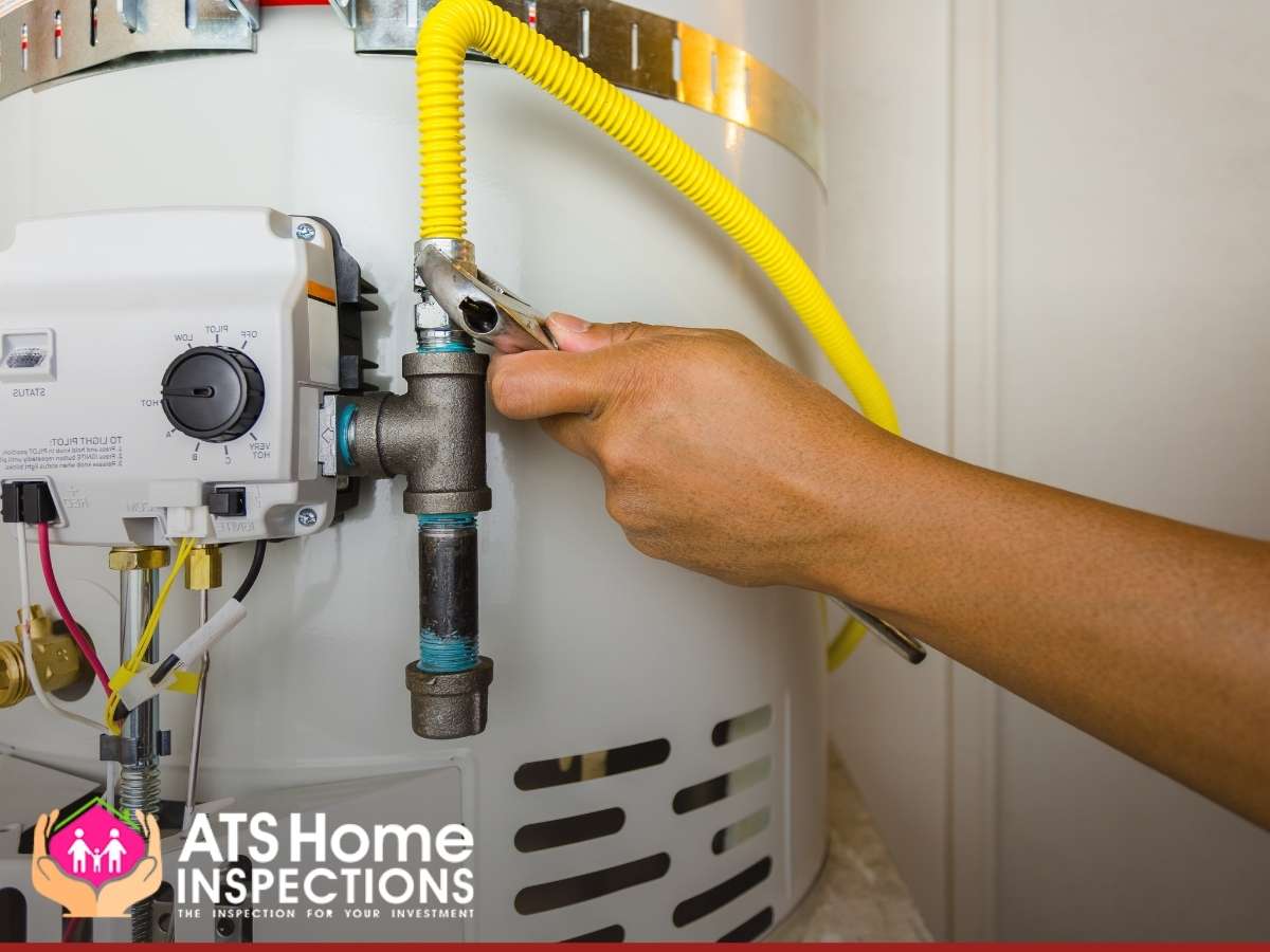 Phoenix home inspectors performing a water heater inspection.